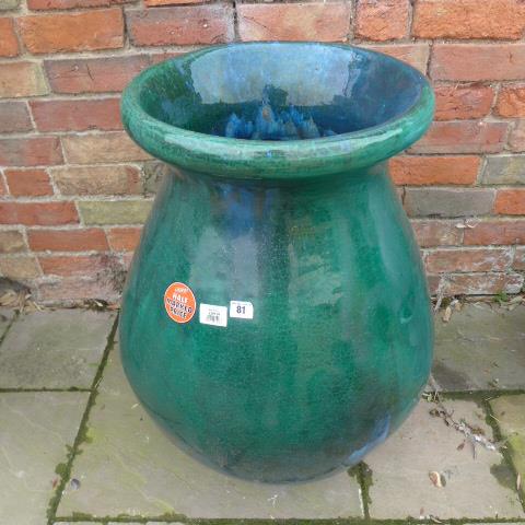 A large green glazed planter - 75cm tall x 53cm diameter x 43cm diameter top RRP: £150