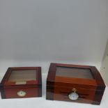 Two counter top cigar humidors - the largest by Passatore - missing tray otherwise generally