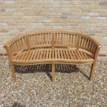 A teak banana bench