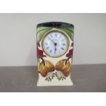 A Moorcroft quart mantle clock - Height 16cm - needs new battery