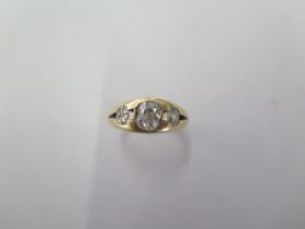 An 18ct yellow gold three stone diamond ring size O - the central diamond approx 6mm x 5mm x 3.5mm