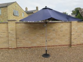 A 3m x 3m blue parasol and base