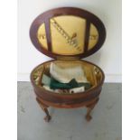 An oval mahogany inlaid workbox with contents - Height 49cm x 60cm x 44cm