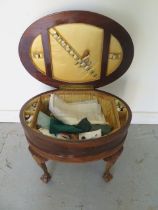 An oval mahogany inlaid workbox with contents - Height 49cm x 60cm x 44cm