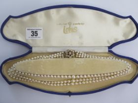 A triple string of Lotus cultured pearls with a 375 9ct clasp - Length 43cm - largest pearl approx