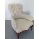 A recently reupholstered Victorian button back walnut fireside armchair - in good condition