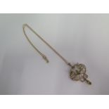A 9ct yellow gold pearl and peridot pendant - Height 5cm - on a 9ct fine chain - total weight approx