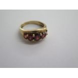 A 9ct yellow gold five stone garnet ring size Q - approx weight 4.6 grams - in good condition