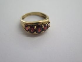 A 9ct yellow gold five stone garnet ring size Q - approx weight 4.6 grams - in good condition