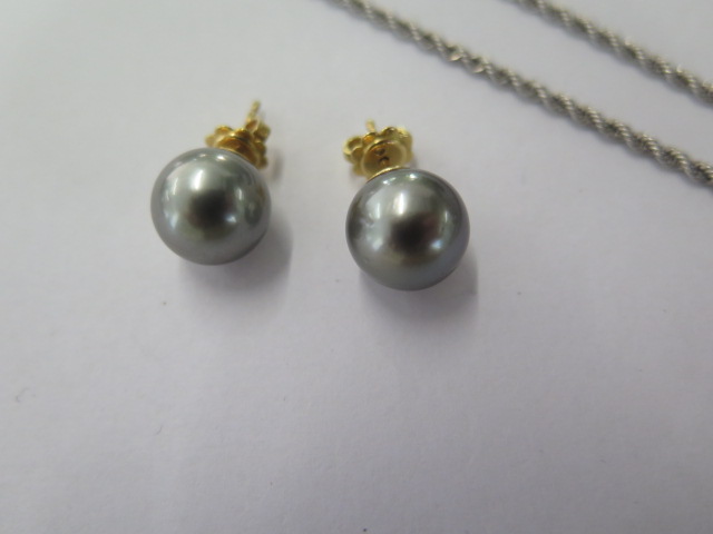 A white metal diamond set tear drop black pearl pendant on an 18ct white gold 42cm chain along - Image 3 of 5
