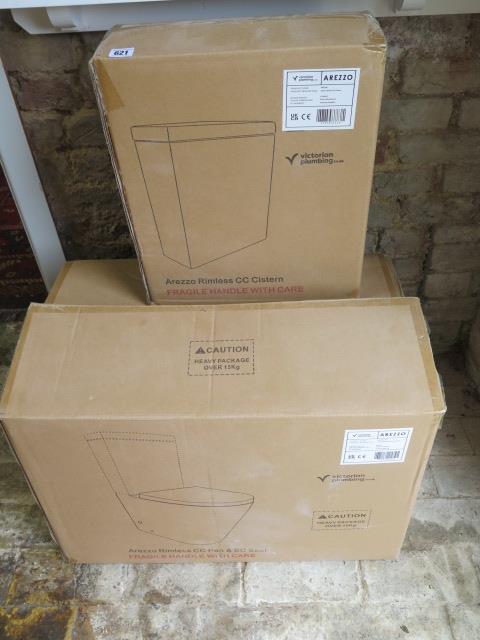 A boxed white Arezzo rimless toilet CC pan and SC seat with rimless CC Cistern from Victoria