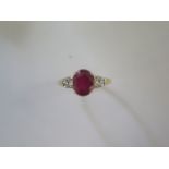 A 9ct yellow gold ruby and diamond ring, head size approx 16mm x 9mm - ring size approx R - In