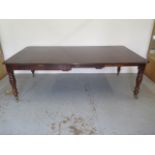 A mahogany pull out dining table with two leaves on turned legs - extends from 120cm to 230cm x 74cm