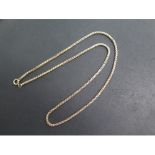 A yellow metal 61cm chain - tests to approx 9ct, approx weight 21.9 grams - in good condition