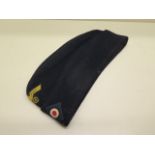 A German WWII type blue side cap - in good condition