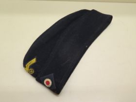 A German WWII type blue side cap - in good condition