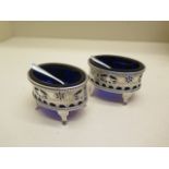 A pair of silver salts with blue glass liners and silver spoons - silver weight approx 2.6 troy oz