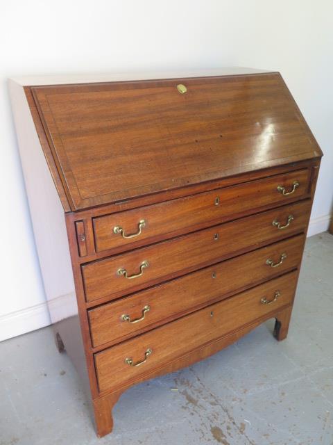 A 19th century mahogany four drawer bureau with a fitted interior - Height 111cm x 92cm x 50cm