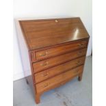 A 19th century mahogany four drawer bureau with a fitted interior - Height 111cm x 92cm x 50cm