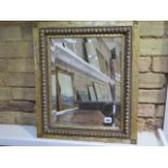 A gilt wall mirror with bevelled edged glass - 56cm x 47cm