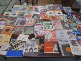 A collection of 25 45rpm pop records with related magazines including Tom Jones, The Ivy League,