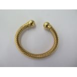 An 18ct 750 yellow gold rope twist torque bangle - approx weight 46 grams - in good condition