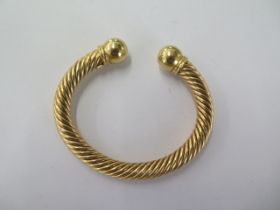 An 18ct 750 yellow gold rope twist torque bangle - approx weight 46 grams - in good condition