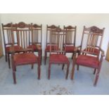 A set of eight early 1900's mahogany dining chairs including two carvers with drop in seats - Height