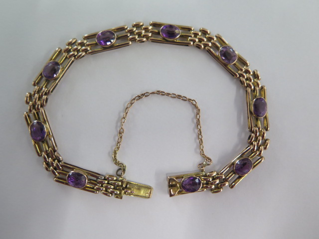 A 9ct yellow gold amethyst bracelet - approx weight 11 grams - slight wear mainly to stones