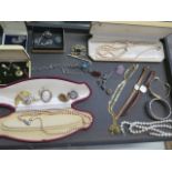 A collection of assorted costume jewellery and watches including a silver bangle