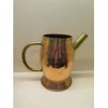 An Arts and Crafts style copper and brass jug - Height 30cm - generally good, some denting