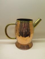 An Arts and Crafts style copper and brass jug - Height 30cm - generally good, some denting