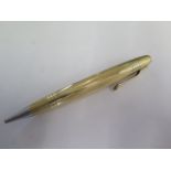 A Mont Blanc gilt plated pencil - Length 11cm - mechanism seems seized, some wear to plate