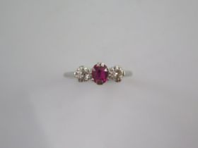 A platinum diamond and ruby type three stone ring size M - approx weight 2.7 grams - stones bright