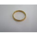 A 22ct yellow gold hallmarked band ring size L - approx weight 3.1 grams