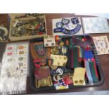 A collection of assorted Militaria including badges, buttons, cigarette cards etc