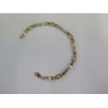 A 9ct yellow and white gold 19cm bracelet - approx weight 8.7 grams - clasp good