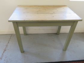 A pine kitchen table with painted base - Height 77cm x 107cm x 68cm