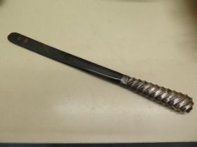 A tortoiseshell page turner with a silver handle - Length 30cm - minor chipping to end, otherwise