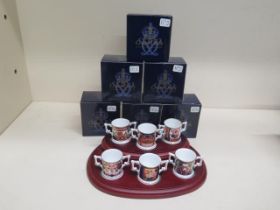 A collection of Limited Edition Royal Crown Derby miniature loving cups on stand all no 102, good