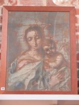 An oil on canvas of Madonna and Child - in poor condition, has been framed under glass - frame