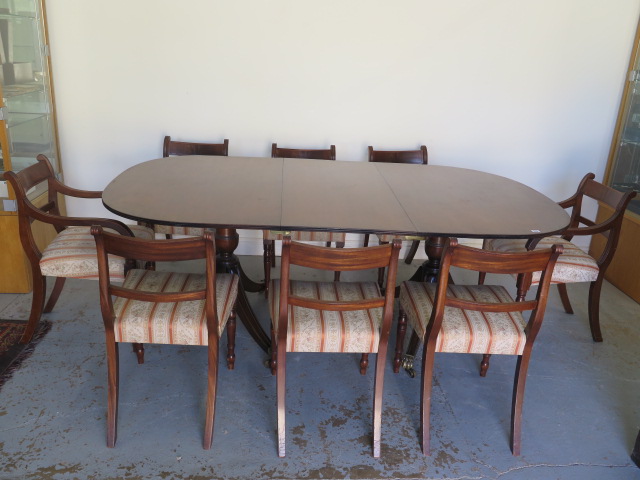 A Georgian style mahogany twin pedestal dining table with one leaf - Height 74cm x 204cm x 114cm