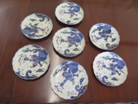 Seven oriental lily pad leaf shaped plates with blue dragon and pearl decoration, 6 character mark