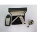 A silver money clip, a silver tie clip and key ring and an interesting white metal lantern cigar