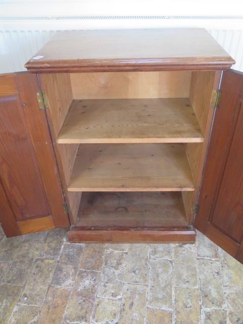 A 19th century pitch pine cupboard with two panelled doors and three internal shelves 92 cm tall x - Image 2 of 2