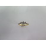 An 18ct yellow gold and platinum three stone diamond ring size K/L - approx weight 1.8 grams -