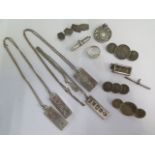 A collection of silver and white metal jewellery including four ingot pendants, three coin brooches,