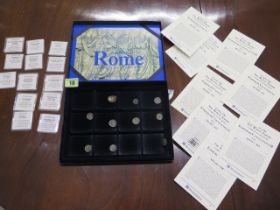 A collection of 10 Roman coins in a coin collectors box with History of Ancient Rome coin collection
