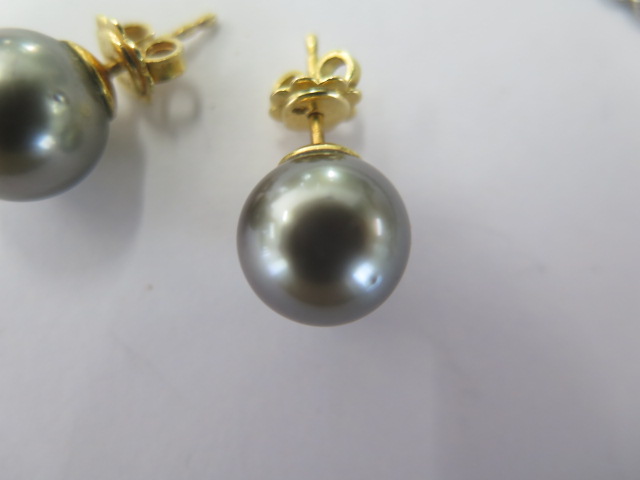 A white metal diamond set tear drop black pearl pendant on an 18ct white gold 42cm chain along - Image 4 of 5