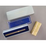A Dunhill gold plated lighter with damage flint holder and a Christian Dior pen case - Length 9.